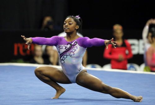 Simone Biles competes in the floor exercise during the U.S. women's gymnastics championships, Friday, June 24, 2016, in St. Louis. (AP Photo/Tony Gutierrez)