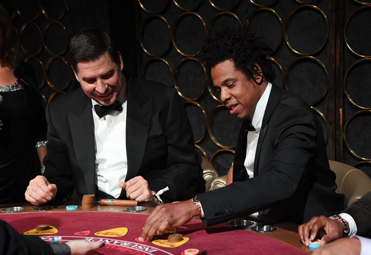 Jay-Z playing baccarat with guests at the Inaugural Shawn Carter Foundation Gala