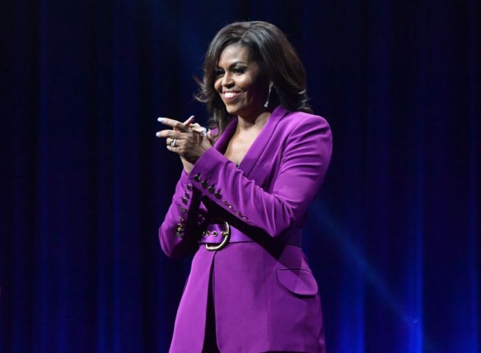 ATLANTA, GEORGIA - MAY 11: Former FirsProm Challenge by Michelle Obamat Lady Michelle Obama attends 'Becoming: An Intimate Conversation with Michelle Obama' at State Farm Arena on May 11, 2019 in Atlanta, Georgia. (Photo by Paras Griffin/Getty Images) ATLANTA, GEORGIA - MAY 11: Former FirsProm Challenge by Michelle Obamat Lady Michelle Obama attends 'Becoming: An Intimate Conversation with Michelle Obama' at State Farm Arena on May 11, 2019 in Atlanta, Georgia. (Photo by Paras Griffin/Getty Images)